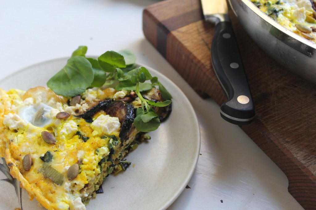 leek-zucchini-frittata-slice-greens